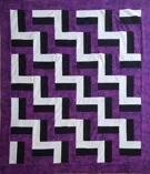 Custom quilt in Purple Rail Fence pattern