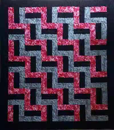 Custom quilt in Rail Fence Red Grey Black pattern